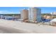 Drone shot showcasing the resort's multiple high-rise buildings, pool, and beach access at 9550 Shore Dr. # 1637/1638, Myrtle Beach, SC 29572