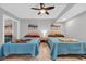 Bedroom featuring two beds, ceiling fan, closet, and decorative art at 9550 Shore Dr. # 1637/1638, Myrtle Beach, SC 29572