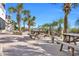 Exterior view of picnic tables surrounded by lush palm trees at 9550 Shore Dr. # 1637/1638, Myrtle Beach, SC 29572