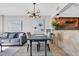 Bright living room featuring modern light fixture and view to kitchen at 9550 Shore Dr. # 1637/1638, Myrtle Beach, SC 29572