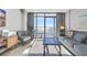 Living room featuring access to private balcony with ocean views at 9550 Shore Dr. # 1637/1638, Myrtle Beach, SC 29572
