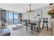 Bright living room featuring floor to ceiling glass doors to private balcony and ocean views at 9550 Shore Dr. # 1637/1638, Myrtle Beach, SC 29572