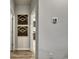 Hallway decorated with wood art and a thermostat with a view of an interior room through an open door at 971 Laconic Dr., Myrtle Beach, SC 29588