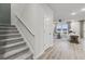 Open-concept living space with stairs, wood floors, and natural light streaming through windows at 971 Laconic Dr., Myrtle Beach, SC 29588