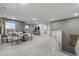 Large living room area with a sofa, table, staircase and a wall mounted tv at 971 Laconic Dr., Myrtle Beach, SC 29588