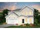 Charming two-story home with white siding, a garage, and a well-manicured lawn at 985 Laconic Dr., Myrtle Beach, SC 29588