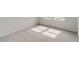 Bright bedroom with plush carpeting and natural light from the double window at 985 Laconic Dr., Myrtle Beach, SC 29588