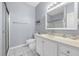 Well-lit bathroom with a shower and tub combination, white vanity, and beach-themed décor at 1058 Sea Mountain Hwy. # 14-302, North Myrtle Beach, SC 29582