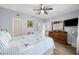 Relaxing bedroom with a starfish-themed bedding, wood dresser, and TV at 1058 Sea Mountain Hwy. # 14-302, North Myrtle Beach, SC 29582