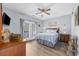Inviting bedroom with wood furniture, French doors, and coastal decor at 1058 Sea Mountain Hwy. # 14-302, North Myrtle Beach, SC 29582