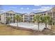 Relaxing community pool surrounded by palm trees and a white picket fence for residents at 1058 Sea Mountain Hwy. # 14-302, North Myrtle Beach, SC 29582