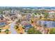 A high definition aerial view of the community pond and multiple homes in the area at 1107 Swan Lake Dr., North Myrtle Beach, SC 29582