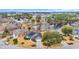 Beautiful aerial view of community near a pond with mature trees and lush landscaping at 1107 Swan Lake Dr., North Myrtle Beach, SC 29582