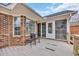 A cozy back porch with brick and screen windows offering a relaxing outdoor space at 1107 Swan Lake Dr., North Myrtle Beach, SC 29582