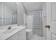 Inviting bathroom featuring a tub/shower combination and vanity with white cabinetry at 1107 Swan Lake Dr., North Myrtle Beach, SC 29582
