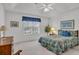 Comfortable bedroom with a ceiling fan, a large window for natural light, and carpeted flooring at 1107 Swan Lake Dr., North Myrtle Beach, SC 29582