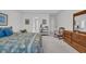 Spacious bedroom features neutral carpet, a ceiling fan, traditional furnishings, and lots of natural light at 1107 Swan Lake Dr., North Myrtle Beach, SC 29582