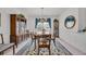 Formal dining room with elegant chandelier and large window at 1107 Swan Lake Dr., North Myrtle Beach, SC 29582