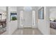 Inviting front foyer with neutral tile flooring, sidelight windows and crisp, white walls for an open, airy appeal at 1107 Swan Lake Dr., North Myrtle Beach, SC 29582