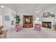 Spacious living room featuring a fireplace, vaulted ceilings, and neutral carpet at 1107 Swan Lake Dr., North Myrtle Beach, SC 29582