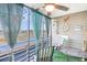 Relaxing enclosed balcony with water views, astroturf and ceiling fan at 123 Dogwood Dr. N # 205-A, Murrells Inlet, SC 29576