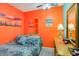 Inviting bedroom with orange accent wall, dresser and coastal themed accents at 123 Dogwood Dr. N # 205-A, Murrells Inlet, SC 29576