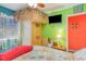 Bedroom featuring tropical themed decorations, bright walls, and ceiling fan at 123 Dogwood Dr. N # 205-A, Murrells Inlet, SC 29576