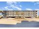 Spacious condo complex with covered parking, showcasing balconies and manicured landscaping at 123 Dogwood Dr. N # 205-A, Murrells Inlet, SC 29576