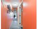 Hallway with vibrant walls, leading to various rooms and decorated with coastal-themed art at 123 Dogwood Dr. N # 205-A, Murrells Inlet, SC 29576