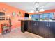 Kitchen with breakfast bar featuring dark wood cabinets, modern appliances, and a view to the outdoor balcony at 123 Dogwood Dr. N # 205-A, Murrells Inlet, SC 29576