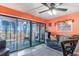 Living room with slider to balcony, ceiling fan, and coastal decor offering a relaxing indoor-outdoor experience at 123 Dogwood Dr. N # 205-A, Murrells Inlet, SC 29576