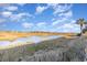 Scenic view of marshland with blue skies and vegetation, offering a tranquil setting at 123 Dogwood Dr. N # 205-A, Murrells Inlet, SC 29576