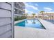 Inviting pool with lounge chairs, set amidst lush landscaping and a well-maintained building exterior at 123 Dogwood Dr. N # 205-A, Murrells Inlet, SC 29576