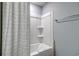 A clean bathroom with a neutral shower curtain and an alcove tub at 1275 Winding Creek Way, Myrtle Beach, SC 29588