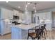 Stylish kitchen featuring a large island, pendant lights, stainless steel appliances, and white cabinetry at 1275 Winding Creek Way, Myrtle Beach, SC 29588