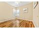 Empty bedroom with hardwood floors, ceiling fan, and plenty of natural light at 1317 Clipper Rd., North Myrtle Beach, SC 29582