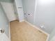 The laundry area is complete with tile floors and essential hookups for easy appliance installation at 152 Rose Water Loop, Myrtle Beach, SC 29588