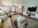 Open-concept living room featuring vaulted ceiling, ceiling fan, and cozy seating at 152 Rose Water Loop, Myrtle Beach, SC 29588