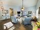 Bright living room featuring vaulted ceiling, modern ceiling fan, and light colored walls at 152 Rose Water Loop, Myrtle Beach, SC 29588