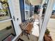 Inviting front porch with an iron bench, angel statue, and classic white columns at 152 Rose Water Loop, Myrtle Beach, SC 29588