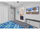 Comfortable bedroom with a beach scene displayed on the TV and a blue quilt on the bed at 1547 Harlow Ct., Myrtle Beach, SC 29579