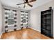 Bedroom with wood floors, two windows with striped curtains, and a black bookshelf at 1547 Harlow Ct., Myrtle Beach, SC 29579