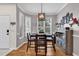Cozy dining room featuring hardwood floors, a modern light fixture, and a large window at 1547 Harlow Ct., Myrtle Beach, SC 29579