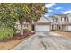 Charming two-story home featuring a brick facade, attached two-car garage, and well-manicured landscaping at 1547 Harlow Ct., Myrtle Beach, SC 29579