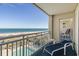 Relaxing balcony with ocean views, lounge chairs, and a glimpse of the swimming pool below at 1581 South Waccamaw Dr. # 304, Garden City Beach, SC 29576