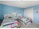 Bright bedroom featuring two twin beds, bedside tables, and closet at 1581 South Waccamaw Dr. # 304, Garden City Beach, SC 29576