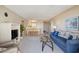 Bright living area featuring a sofa, dining table and a glimpse of the kitchen at 1581 South Waccamaw Dr. # 304, Garden City Beach, SC 29576