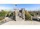 Wooden walkway leads to a sandy beach, framed by lush greenery and blue skies at 1581 South Waccamaw Dr. # 304, Garden City Beach, SC 29576