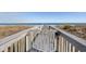 Walkway to beach framed by dunes and ocean views at 1581 South Waccamaw Dr. # 304, Garden City Beach, SC 29576