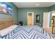 Comfortable bedroom featuring cool-toned walls and a cozy bed with a geometric-patterned duvet at 184 Carolina Lakes Blvd., Myrtle Beach, SC 29588